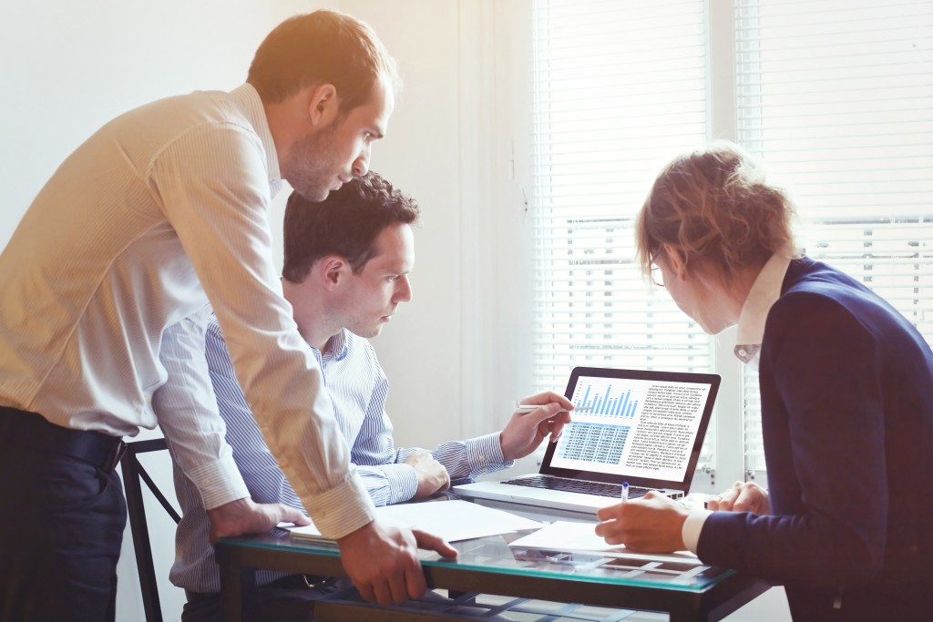 IT Professional showing data to managers