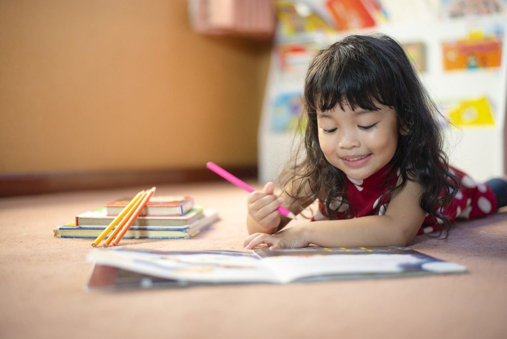 Child coloring a book