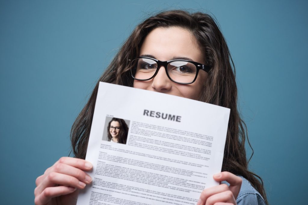 Young adult showing her resume