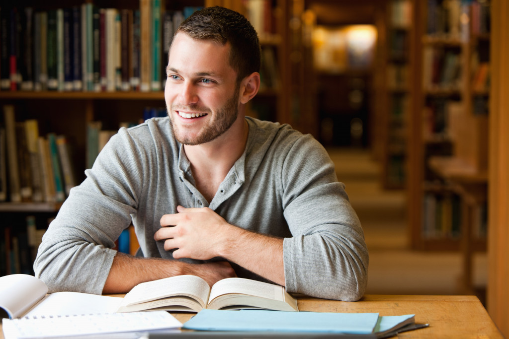 man studying in library