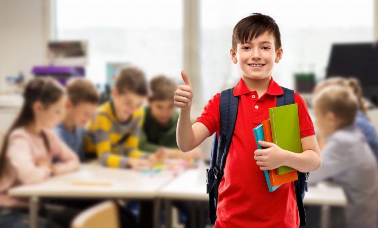 learning kid focused with classmates blurred at the back